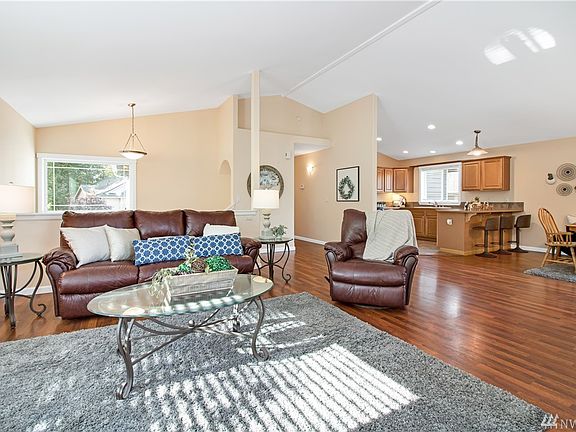 Open and Bright living space with great room concept and vaulted ceilings.