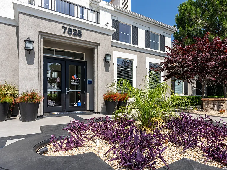 Leasing Office Entry at Villas at the Gardens with Purple Foliage and Palm Detail