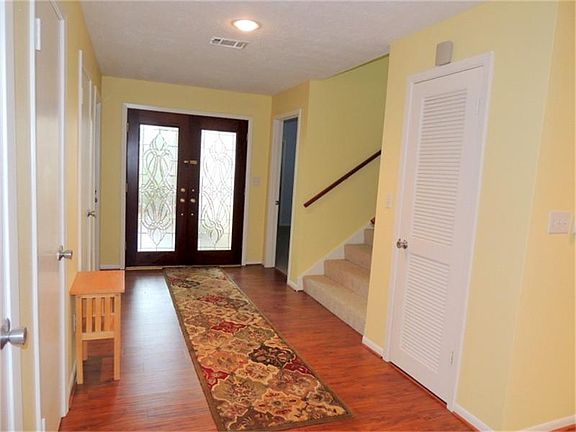 Front entry with stairs leading to upstairs gameroom and 2 bedrooms
