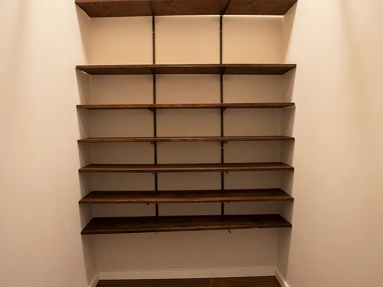 Primary bedroom walk-in closet