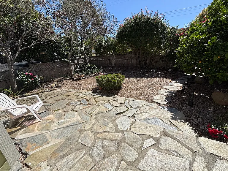Fenced, front patio and yard.