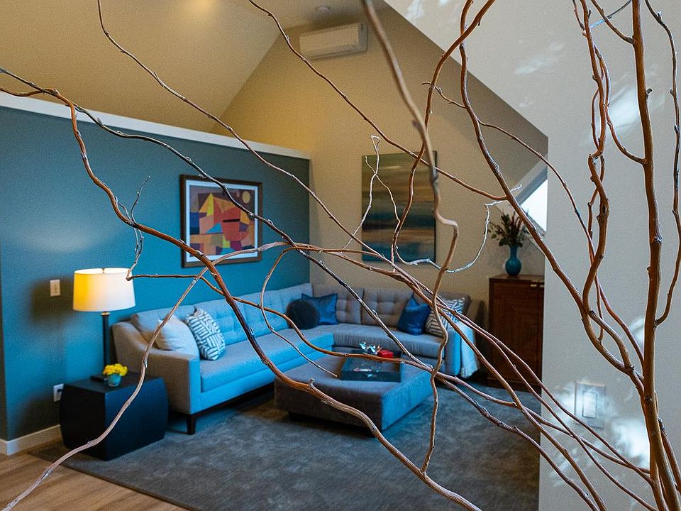 Cozy large living room with sectional, bar, and pop up television. Minisplit heater/AC.