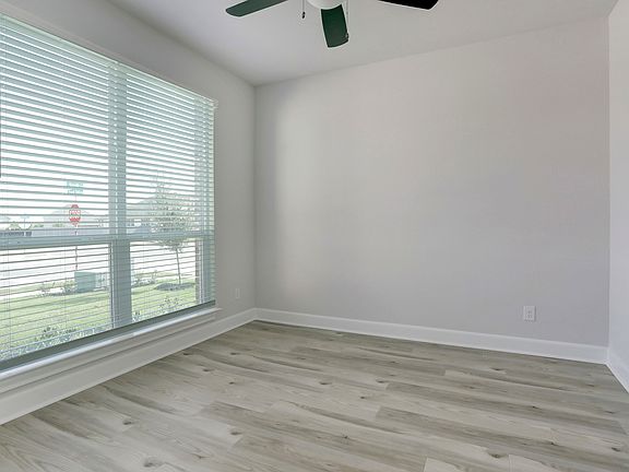 Formal dining or study off of the entry with large windows.