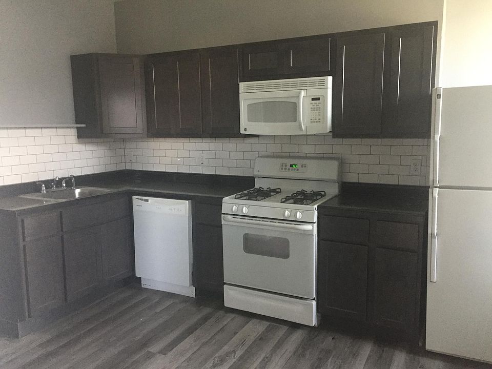 Renovated kitchen with dishwasher, microwave, fridge and sto