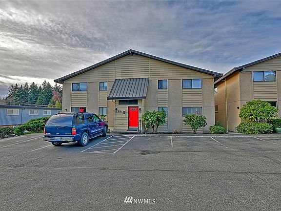 Lots of parking behind the building. The red door is the entrance to the lobby area. 