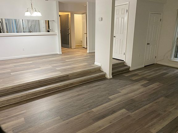 Dining room with large sunken living room.