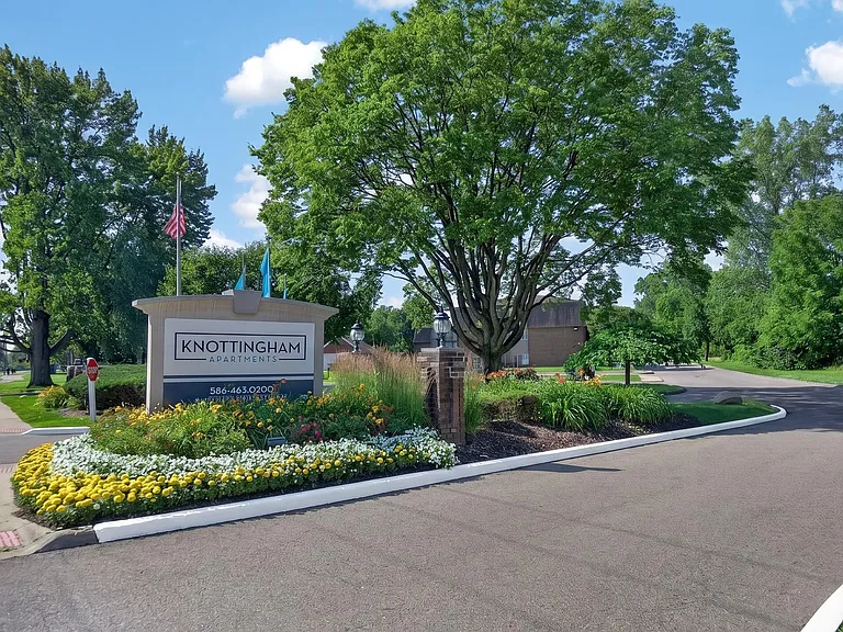 Welcoming entrance at Knottingham Apartments in Clinton Township, MI.