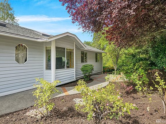 Beautifully detailed front patio allows you to enjoy the garden space