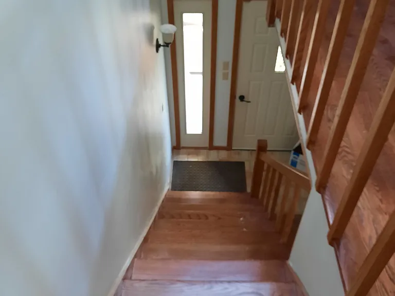 Separate entrance from the side of the house, mudroom adjacent to stairs