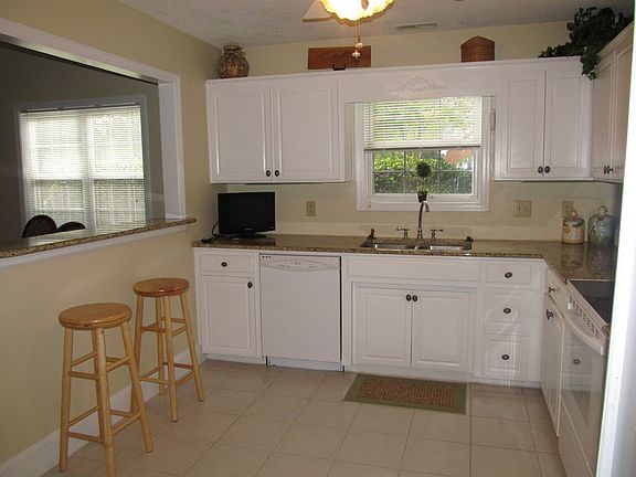Kitchen with granite counter tops and garden view