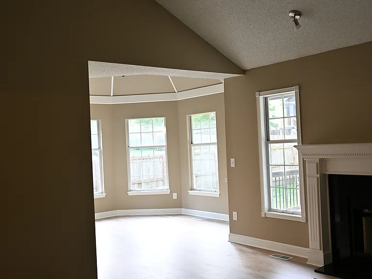 Dining room with vaulted ceiling.