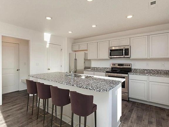 Open floor plan with modern colors and finishes