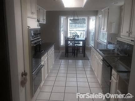 Kitchen
						:
						Double Wall Oven , Gas Cooktop , Granite and Stainless Sink ... Bay window