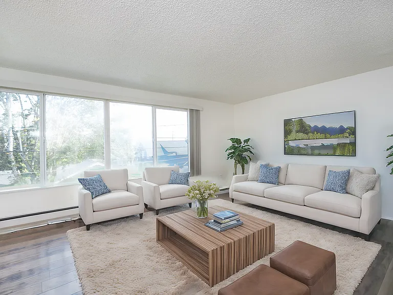 Spacious Tacoma living room with natural light and modern flooring. Spacious Tacoma living room with natural light and modern flooring.