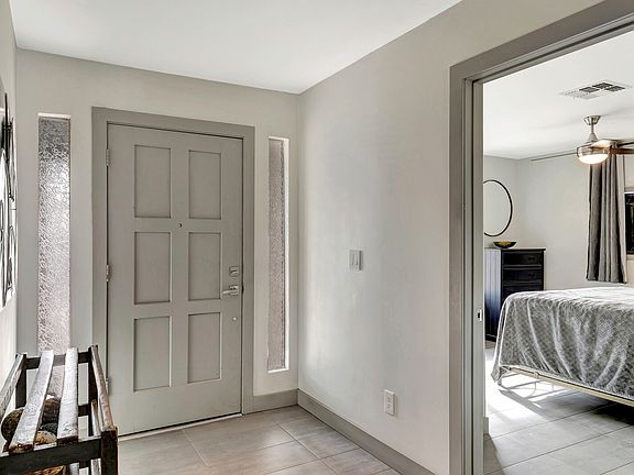 Front entry and bedroom 1 of 5.