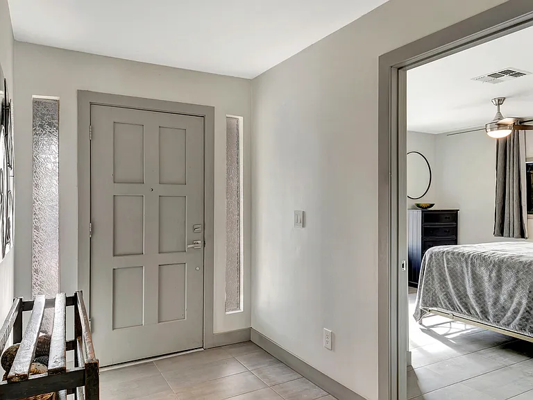 Front entry and bedroom 1 of 5.