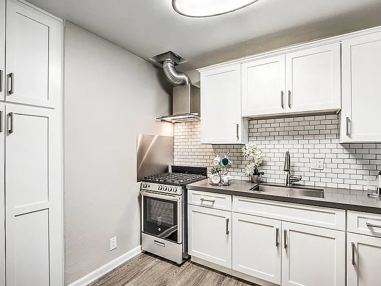 The Island Apartments kitchen with appliances and cupboard