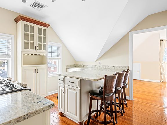Updated Kitchen with Granite Counters, Stainless Appliances and Ample Storage