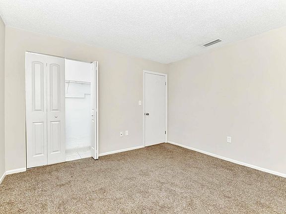 Experience tranquility in this airy bedroom, complete with modern finishes.