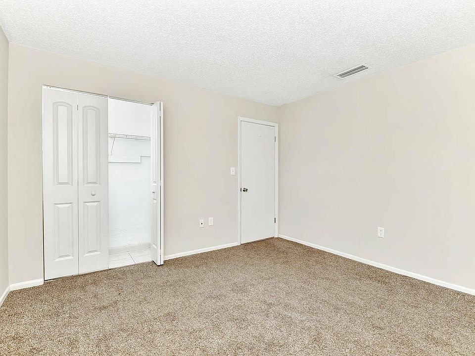 Experience tranquility in this airy bedroom, complete with modern finishes.