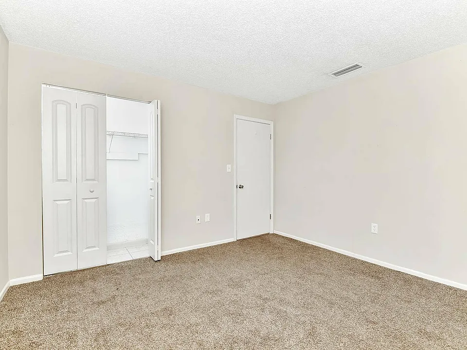 Experience tranquility in this airy bedroom, complete with modern finishes.