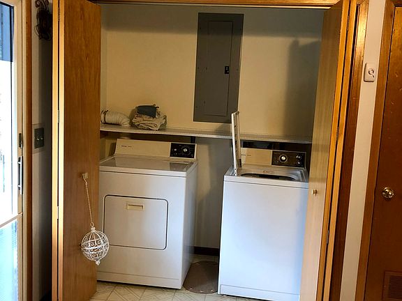 Concealed laundry in kitchen