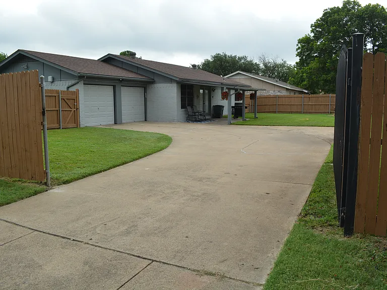 Enjoy our large driveway to fit multiple cars with-in the gated area.