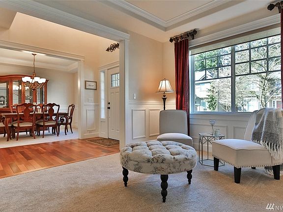 Formal living room offers an ideal spot for quiet conversation.