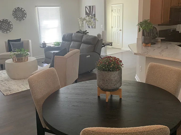 New lighting and paint in dining area with breakfast bar for additional seating.
