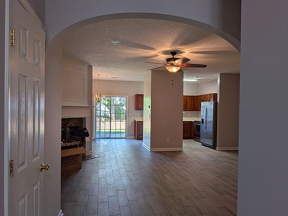 View into living room/kitchen from front hallway entrance.