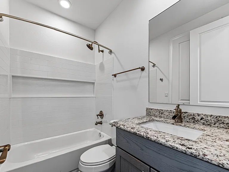Private ensuite bathroom with modern finishes.