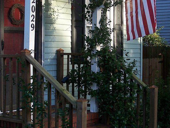 Front stoop with railing and jasmine