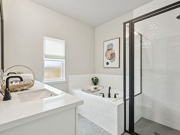 Owner s bath with glass shower enclosure