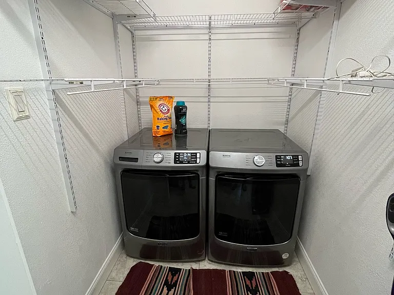 Laundry with W/D off kitchen