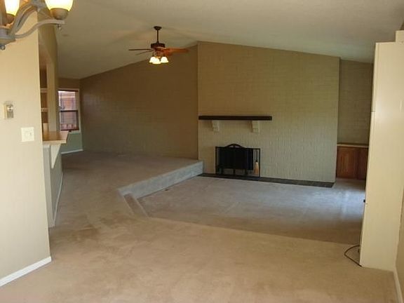 Livingroom with vaulted celings and fireplace