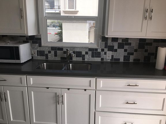 Kitchen with microwave, oven & refrigerator