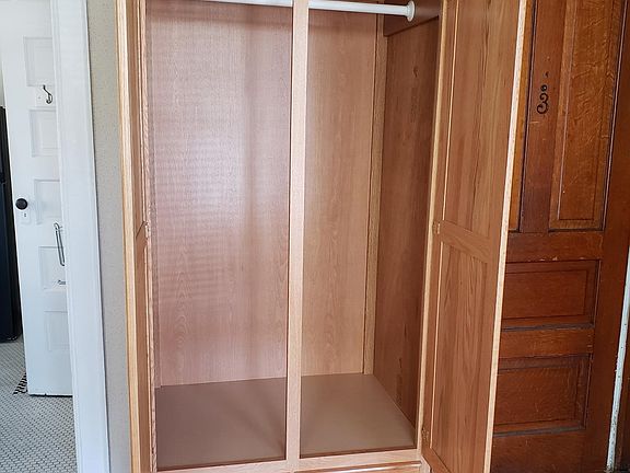 Oak storage unit/closet in living area
