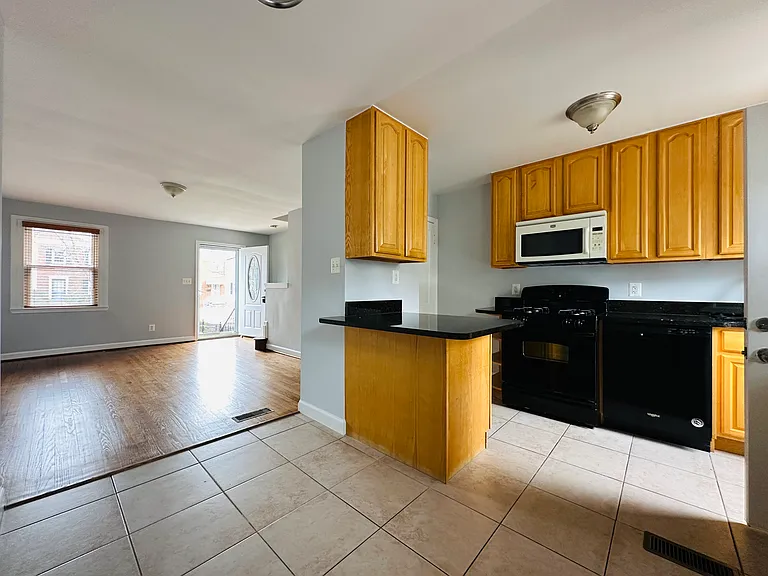 Dining room, kitchen, and family room.
