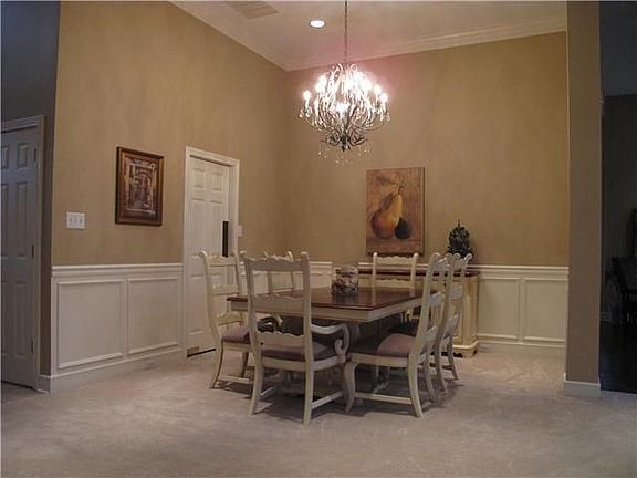 Enjoy meals in Formal Dining Room. Door on left leads to a Butler’s Pantry.