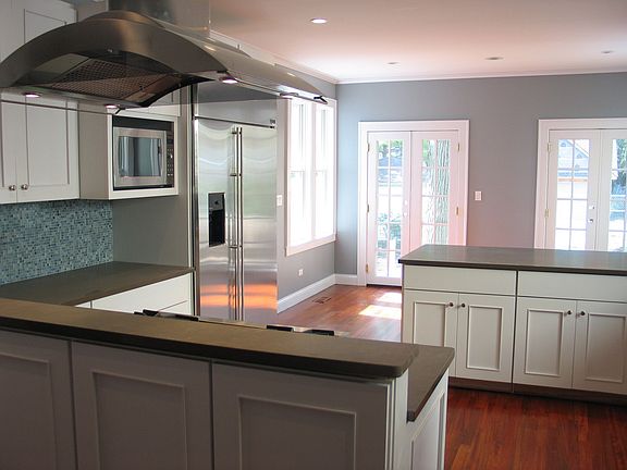 Kitchen has large eat-in table space + bar seating