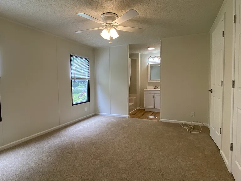 Primary Bedroom w/ Carpet
