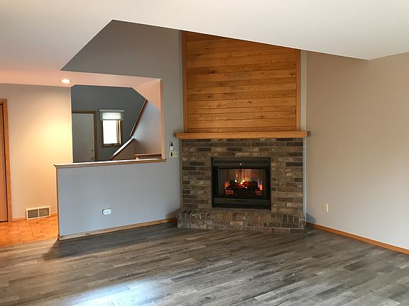 Two story living room withFP