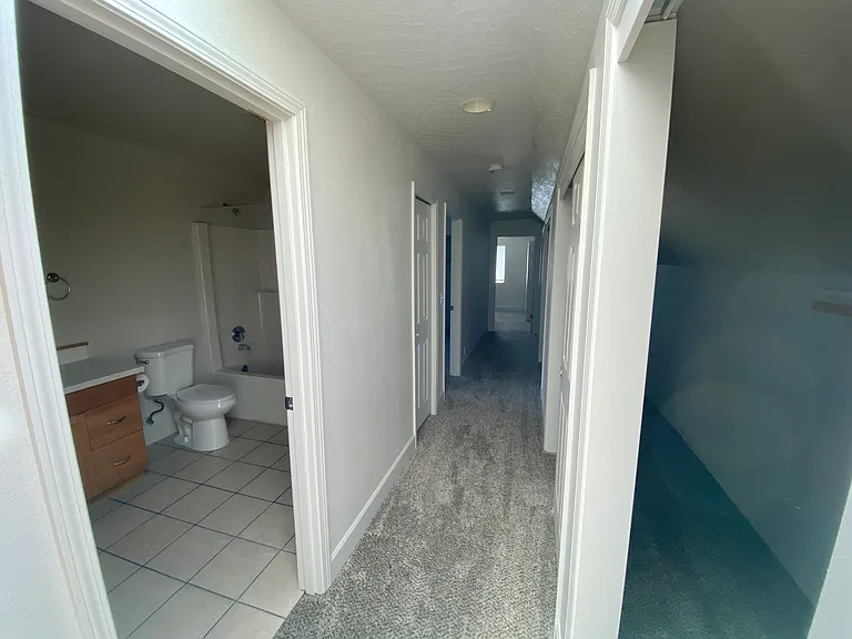 Upstairs hallway - bathroom and bedroom #1 on the right. Bedroom #2 at the end, closet the entire length of the hallway to the right.