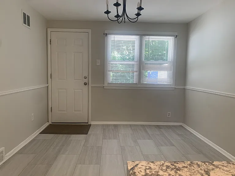 Dining area that leads to patio and parking