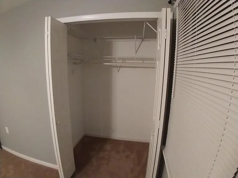 Bedroom 2 large closet with lots of shelving