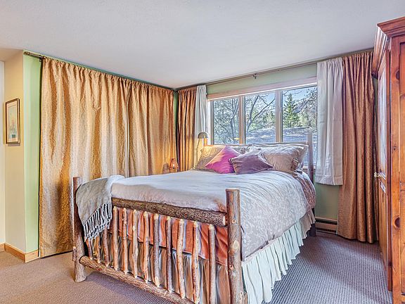 bedroom, there is also a sliding outside door in the room.