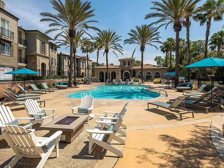 Outdoor Pool Area with Fire Feature and Lounge Seating