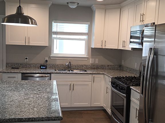 Kitchen - gas stove, dishwasher and refrigerator