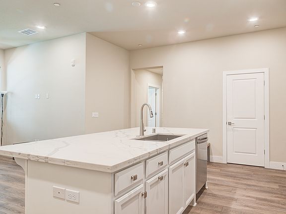 Kitchen with Island bar and sink