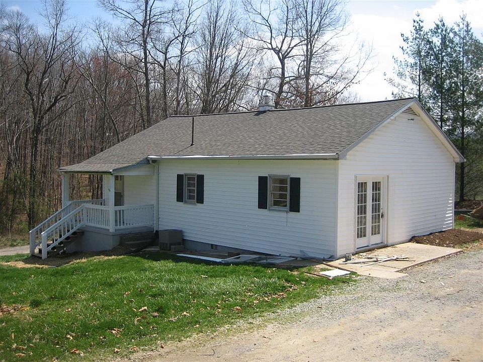 House Front. Side Entry next to Gravel Driveway